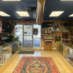 Opposite wide view of Canutillo Smoke Shop showcasing additional product displays and store layout.