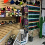 Fox Plaza Smoke Shop’s Hispanic heritage tribute corner featuring a sera[e and papel picado decorations.