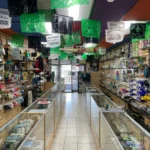 Interior view of Fox Plaza Smoke Shop looking towards the exterior, showcasing the store’s layout and welcoming entrance.