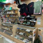 Vape devices, incense, RAW shirts, wood, and metal pipes at Fox Plaza Smoke Shop.
