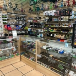 Vape juice, disposable vapes, shisha, and torches lineup at Mesa Smoke Shop on N Mesa St