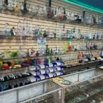 Water pipes, bongs, and bubblers in the glass case at Mesa Smoke Shop on N Mesa St