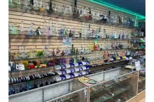 Water pipes, bongs, and bubblers in the glass case at Mesa Smoke Shop on N Mesa St