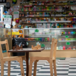 Montana Smoke Shop — chess-board floor and counter display, the store's signature look — Five Points District, El Paso, TX