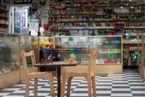 Montana Smoke Shop — chess-board floor and counter display, the store's signature look — Five Points District, El Paso, TX