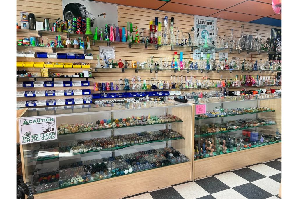 Montana Smoke Shop — colorful glass hand pipes, bongs, bubblers and dab rigs in our wall display — Five Points District, El Paso, TX