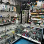 Ceramic glass, nicotine disposable vapes, cigarillos, and paper cones at Resler Vape Shop.