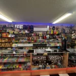 Selection of precision scales and herbal smoking products, including Delta-8 and THCA, at Doniphan Smoke Shop.