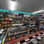 Display of vape products, herbal kratom, RAW rolling papers, and detox supplies at Doniphan Smoke Shop.