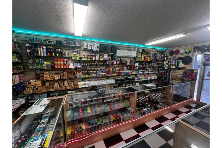 Display of vape products, herbal kratom, RAW rolling papers, and detox supplies at Doniphan Smoke Shop.