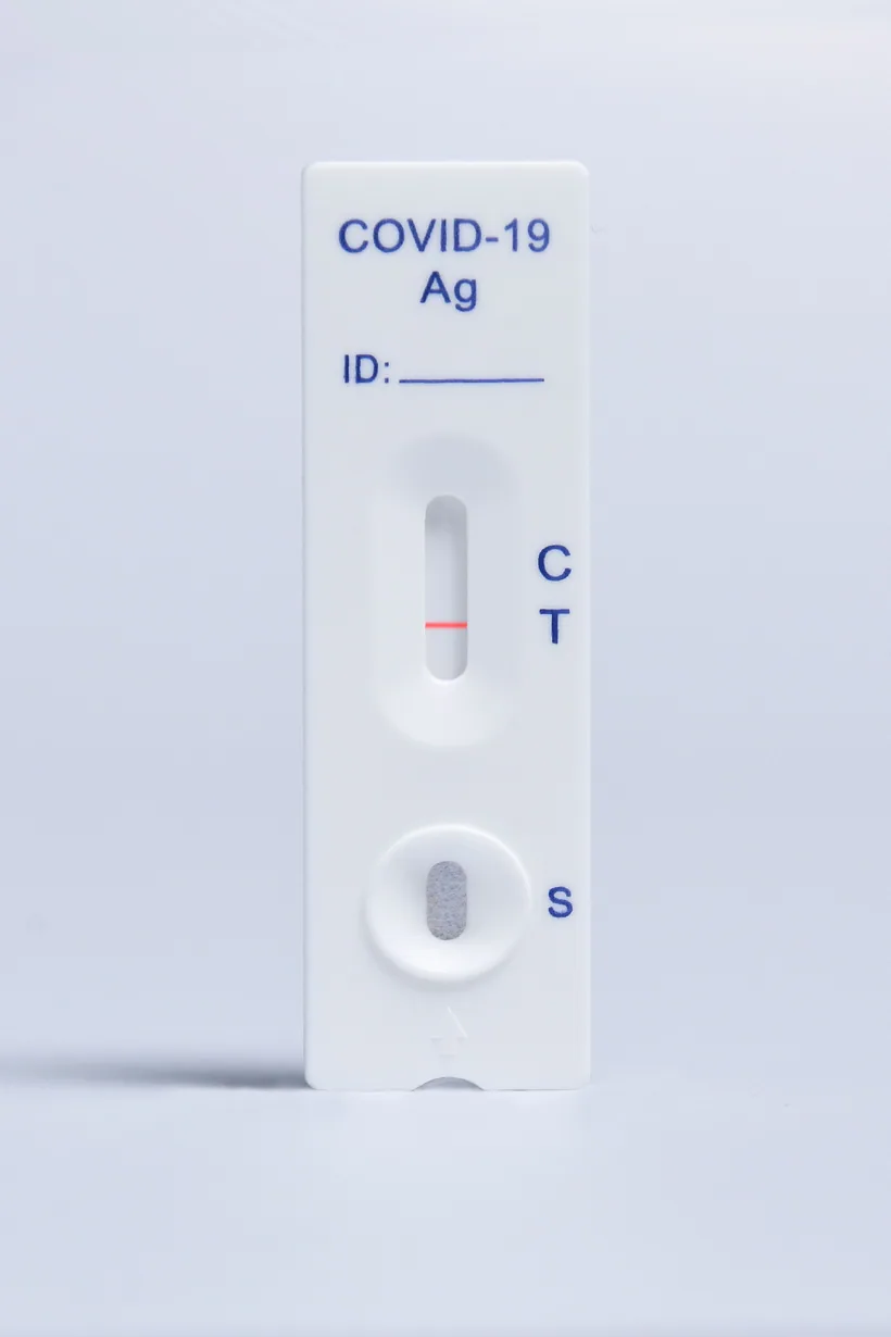 Close-up of a white test cassette with a single colored line beside the printed C and T result markings at El Paso Smoke Shops
