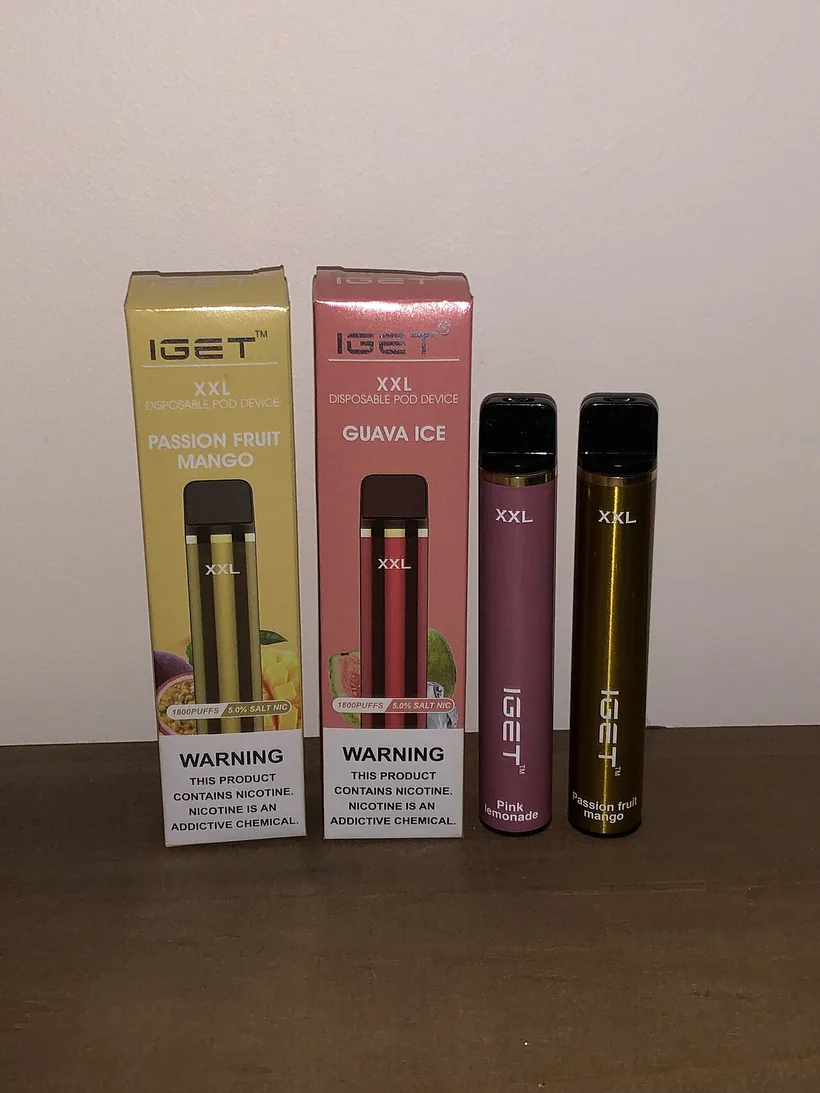 IGET disposable vapes displayed with their retail boxes showing nicotine warning labels at El Paso Smoke Shops