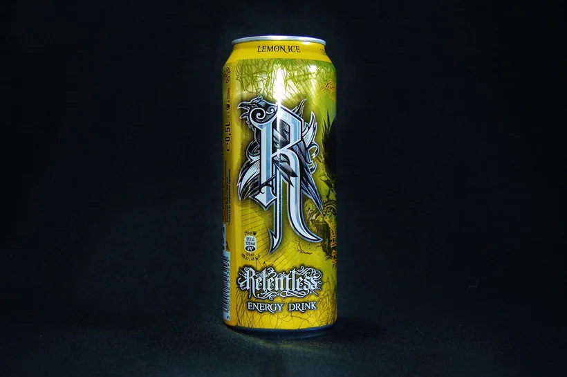 A single tall aluminum can clearly labeled "Energy Drink" lit against a dark studio backdrop, like the individual energy drinks compared by caffeine at El Paso Smoke Shops