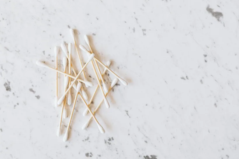 Cotton swabs scattered on a marble surface, the kind of hand tool used to detail tight joints and bowls during a no-scrub soak clean, at El Paso Smoke Shops