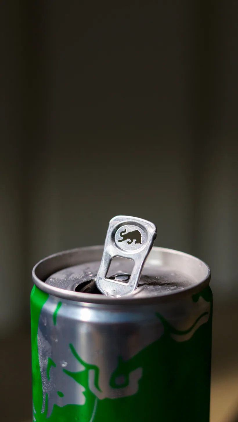 Close-up of a freshly opened slim sparkling energy drink can at El Paso Smoke Shops
