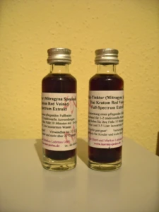 Two small bottles of liquid full-spectrum kratom extract tincture with Mitragyna speciosa red-vein labels at El Paso Smoke Shops