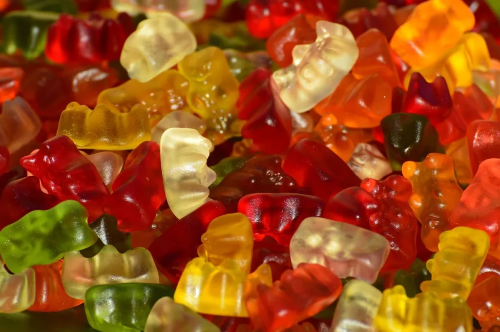 Close-up of colorful fruit gummies filling the frame, illustrating kratom gummy edibles at El Paso Smoke Shops
