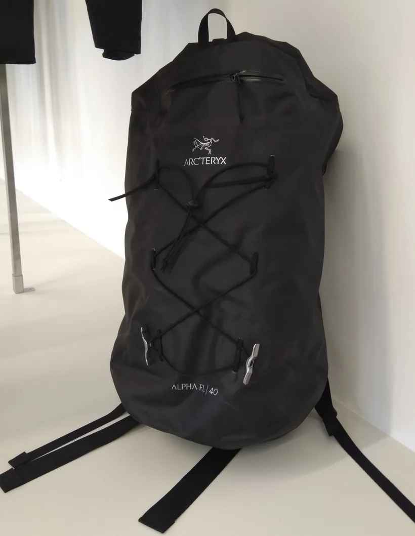 A sleek black technical backpack shown isolated on a plain background, representative of the smell-proof backpack brands compared at El Paso Smoke Shops