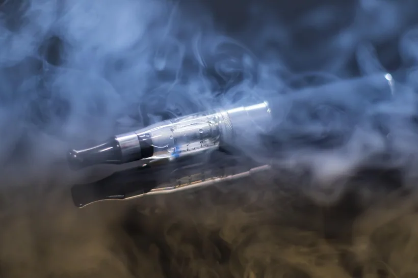 E-cigarette vape device surrounded by a cloud of exhaled aerosol at El Paso Smoke Shops