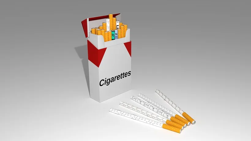 Open pack of cigarettes with loose cigarettes beside it at El Paso Smoke Shops