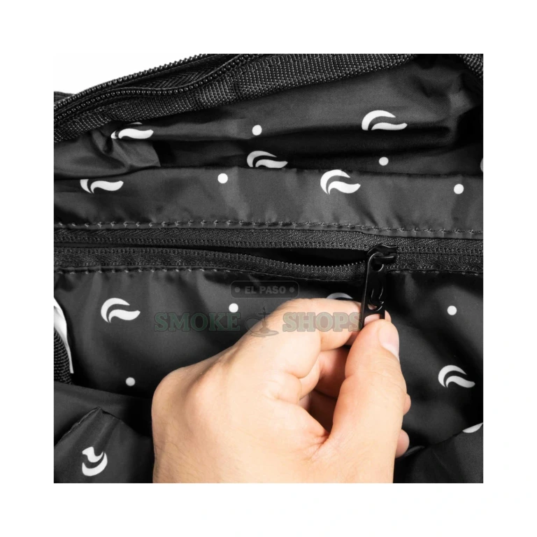 Skunk Drifter crossbody smell-proof bag in El Paso, close-up of nylon texture and padded fabric, black