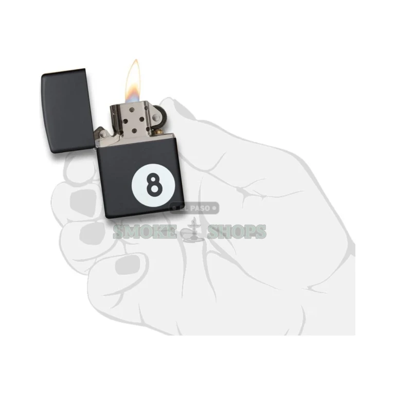 Zippo 28432 8-ball lighter held in hand to show the Classic brass case size and matte texture