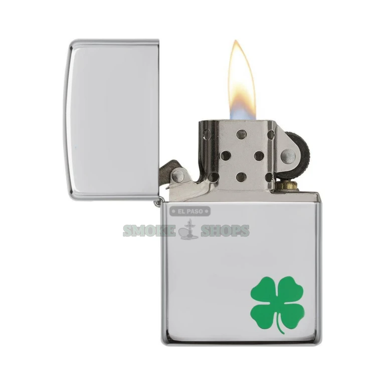 Zippo A Bit O' Luck High Polish Chrome windproof lighter with a small green four-leaf clover in the lower-right corner, front view