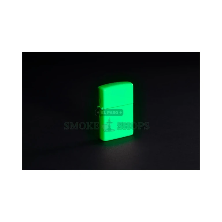 Zippo 49193 glow in the dark lighter glowing green in a dark room after charging in light