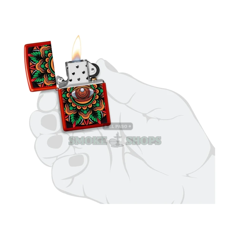 Zippo Counter Culture Eye Design lighter at an angle beside its Zippo gift box