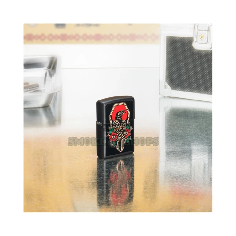 Close-up of the traditional tattoo-style crow and floral Color Image on the Black Matte Zippo 48611 case