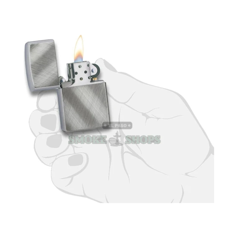 Close-up of the Diagonal Weave brushed chrome finish on a Zippo lighter case, with directional diagonal brushing