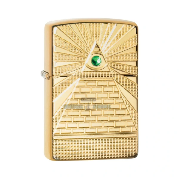 Zippo Eye of Providence windproof lighter in High Polish Brass with a deep-carved pyramid and green crystal all-seeing eye, lid closed