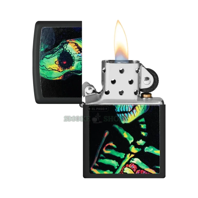Zippo Glowing Skull design glowing vivid blue under a UV black light showing the sugar-skull skeleton