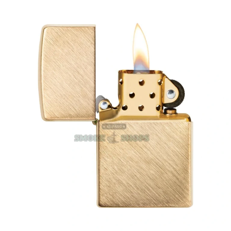 Open Zippo Herringbone Sweep brass lighter with lit flame and windproof chimney