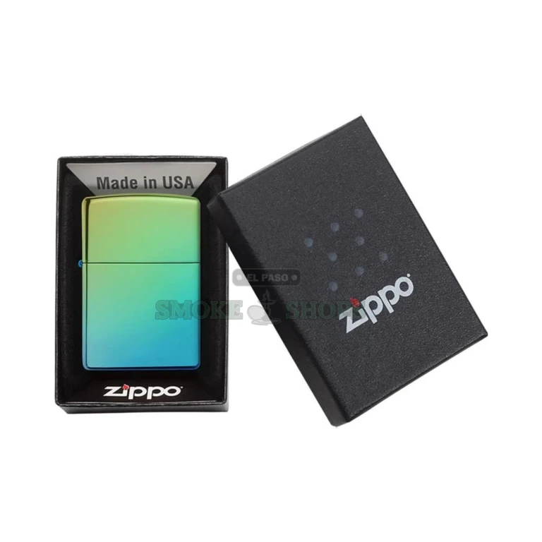 Close-up of the Zippo 49191 High Polish Teal mirror finish reflecting turquoise and lime tones in the light