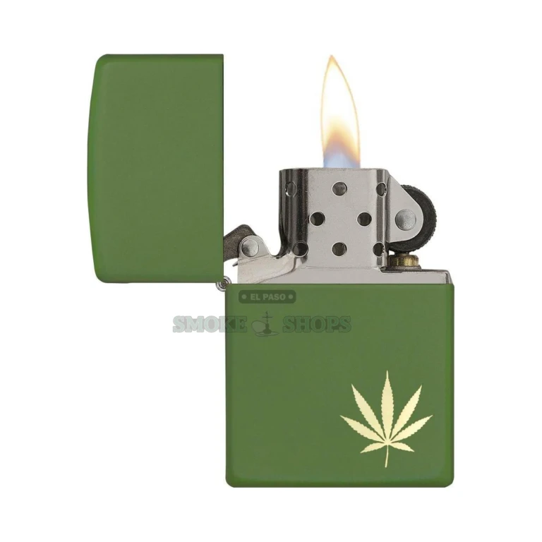 Brushed chrome Zippo lighter with engraved marijuana leaf design, angled side view