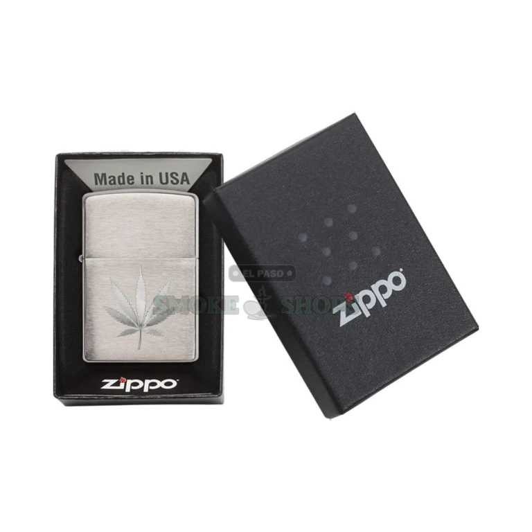 Zippo 29587 windproof lighter in brushed chrome with an engraved marijuana leaf on the front, lid closed