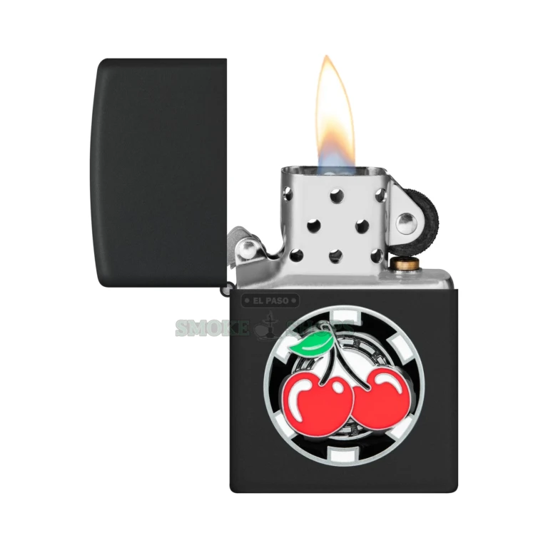 Close-up of the metallic poker chip and lucky cherries emblem on the black matte Zippo case
