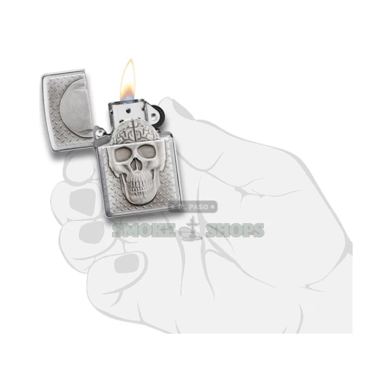 Zippo Skull with Brain windproof lighter lit, showing the windproof flame above the chimney