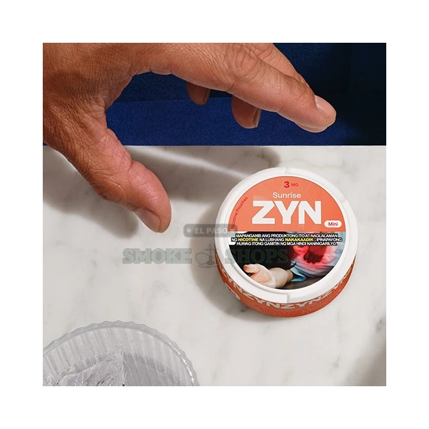 ZYN tobacco-free nicotine pouches in El Paso, all-white slim pouch shown out of the round plastic can
