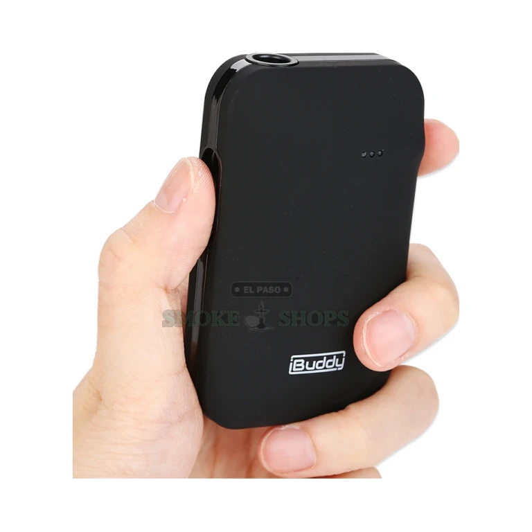 Angled view of the black iBuddy i1 heat-not-burn device in El Paso showing the pin-style heating chamber opening