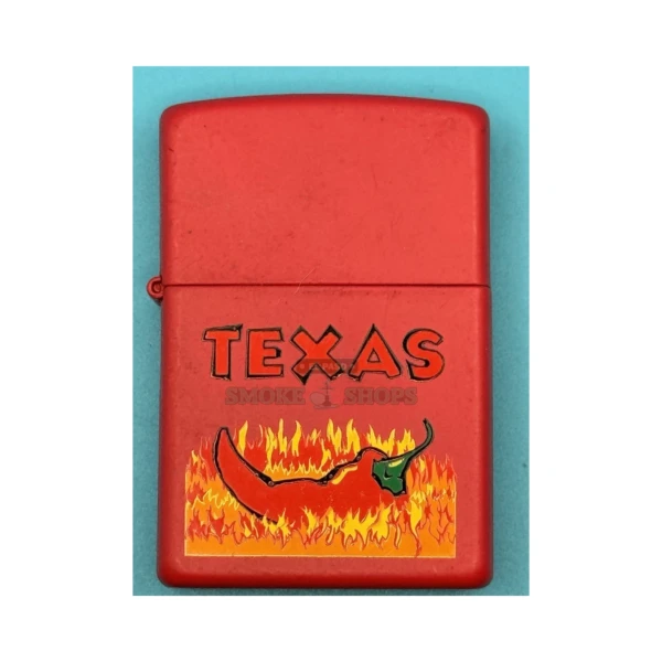 Zippo Texas Red Pepper windproof lighter with a bright red chili pepper design on a brass case at El Paso Smoke Shops